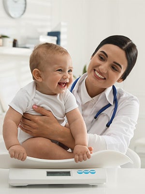 Baby and Doctor laughing